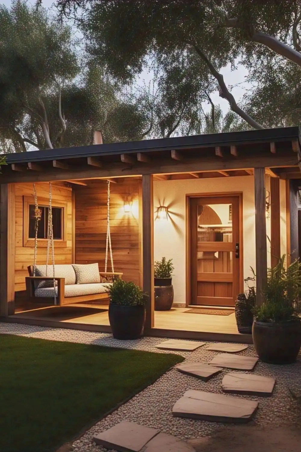 Cozy wooden porch with swing and plants.