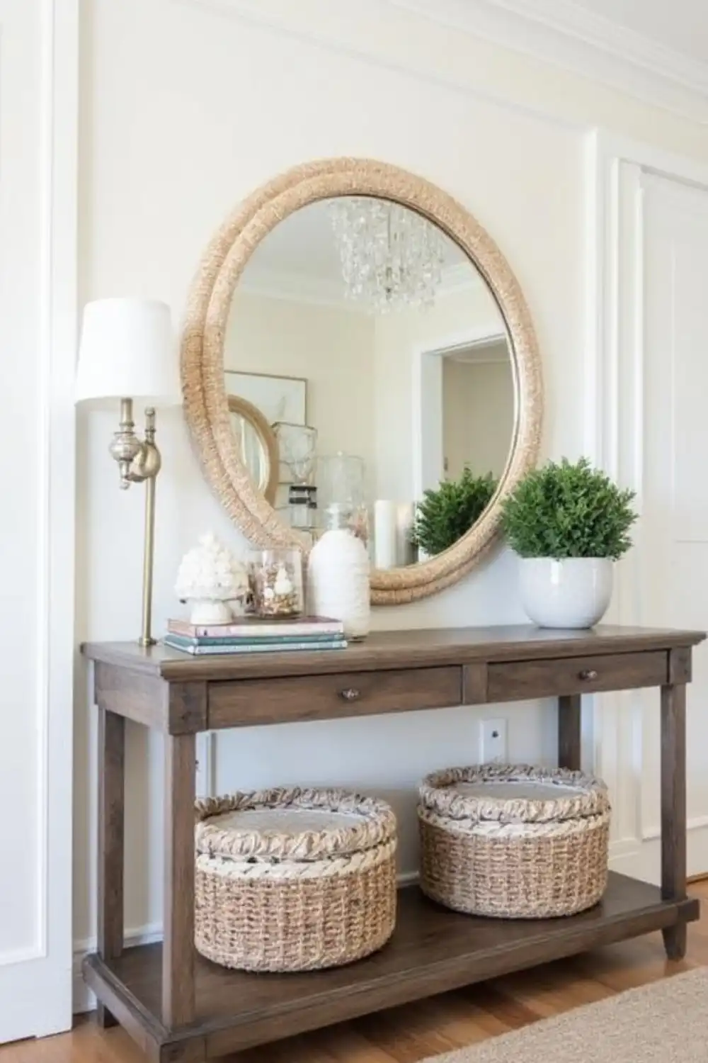 Stylish entryway table with mirror and decor.