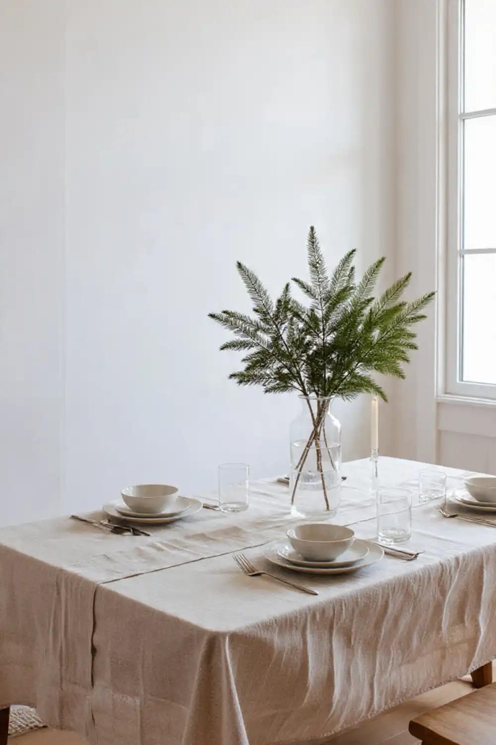 Minimalist dining table with vase and tableware