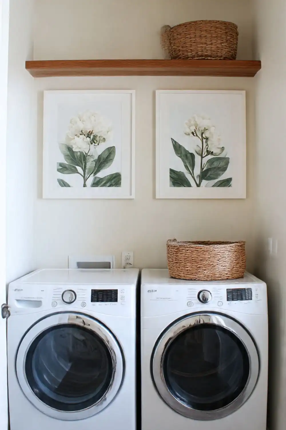 Laundry room with washer, dryer, and decorative art.
